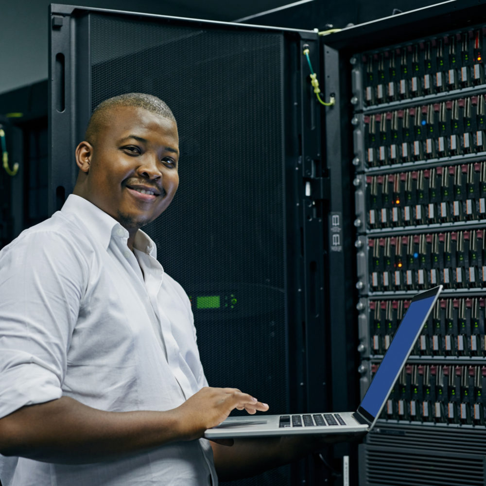 man in data center providing IT network maintenance