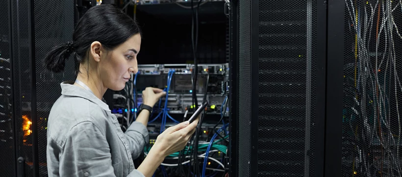 female network technician conducting IT infrastructure lifecycle management