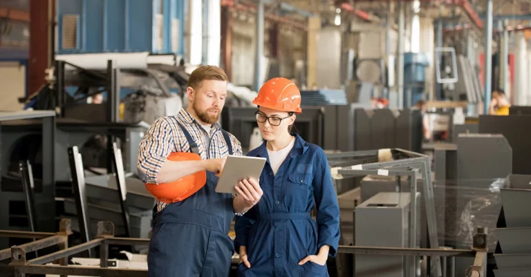 male and female engineers following wifi site survey checklist in factory
