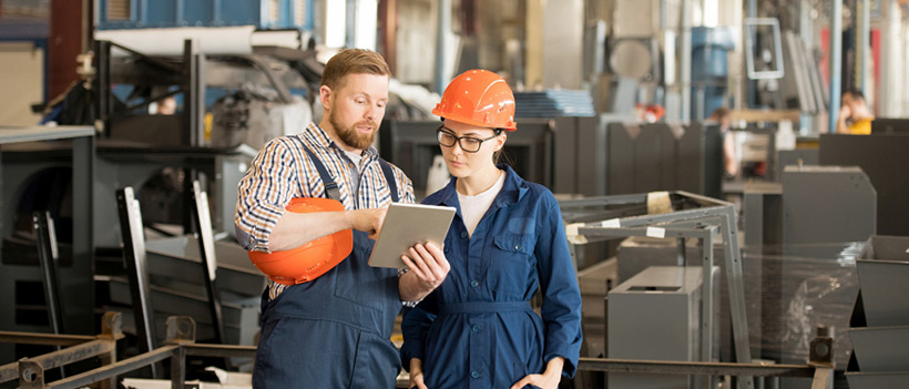 male and female engineers following wifi site survey checklist in factory