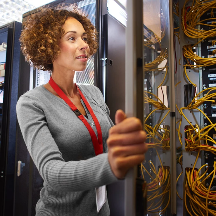 woman representing server management companies in data center