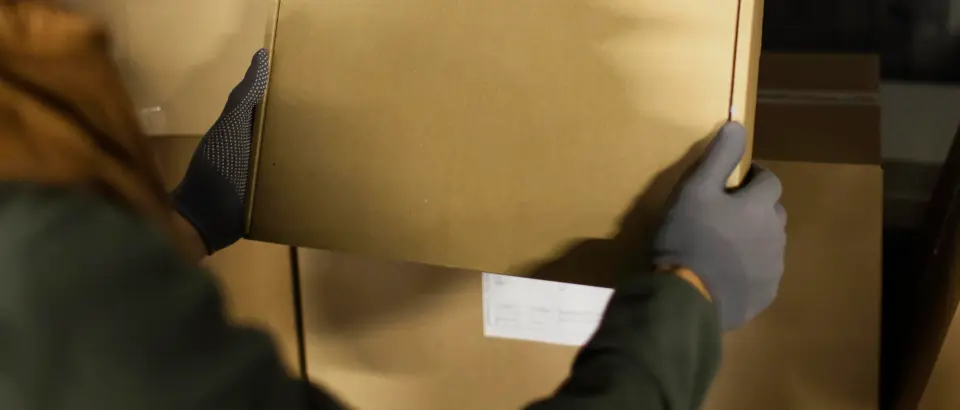 man moving a data center with many packages